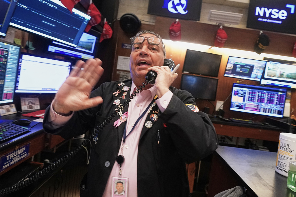 Trader Jonathan Mueller works on the floor of the New York Stock Exchange, Friday, Jan. 2, 2026. (AP Photo/Richard Drew)