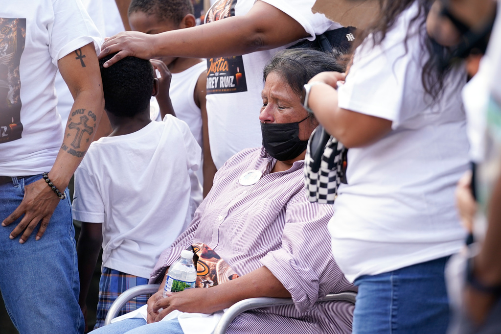 Family members react as they gather at a memorial Thursday, July 23, 2026, in Madison, Wis., where a Madison police officer shot and killed Corey Durell Ruiz on Wednesday. (AP Photo/Kayla Wolf)