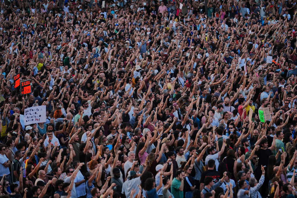 People gather during a protest following the eviction last Wednesday of 87-year-old Maricarmen to demand stronger laws to protect renters at Puerta del Sol in Madrid, Spain, Saturday, Sept. 26, 2026. (AP Photo/Manu Fernandez)