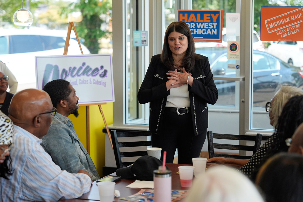 Rep. Haley Stevens, D-Mich., a candidate in the Democratic primary for U.S. Senate in Michigan, speaks during a campaign event at Corine's Soul Food, Cakes & Catering Monday, Aug. 3, 2026, in Muskegon Heights, Mich. (AP Photo/Paul Sancya)