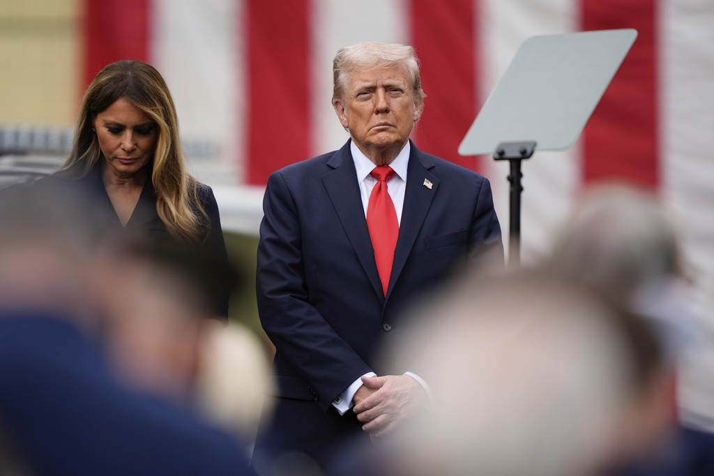 President Donald Trump, right, and first lady Melania Trump attend a ceremony in the Pentagon courtyard to commemorate the 24th anniversary of the 9/11 attacks, Thursday, Sept. 11, 2025, in Washington. (AP Photo/Julia Demaree Nikhinson)