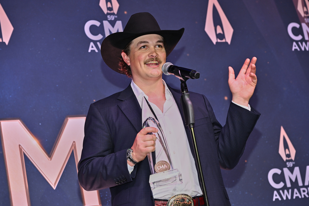 FILE - Zach Top, winner of the award for new artist of the year, poses in the press room during the 59th Annual Country Music Association Awards on Wednesday, Nov. 19, 2025, at Bridgestone Arena in Nashville, Tenn. (Photo by Evan Agostini/Invision/AP, File)