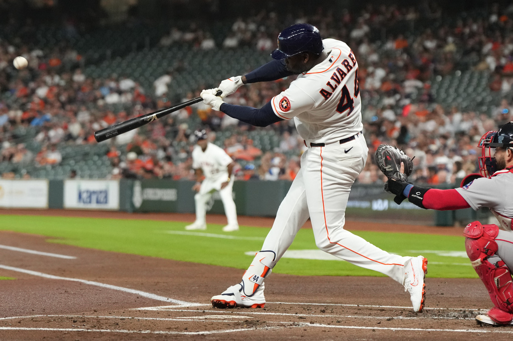 Houston Astros' Yordan Alvarez hits an RBI double during the first inning of a baseball game against the Boston Red Sox in Houston, Tuesday, March 31, 2026. (AP Photo/Jon Shapley)