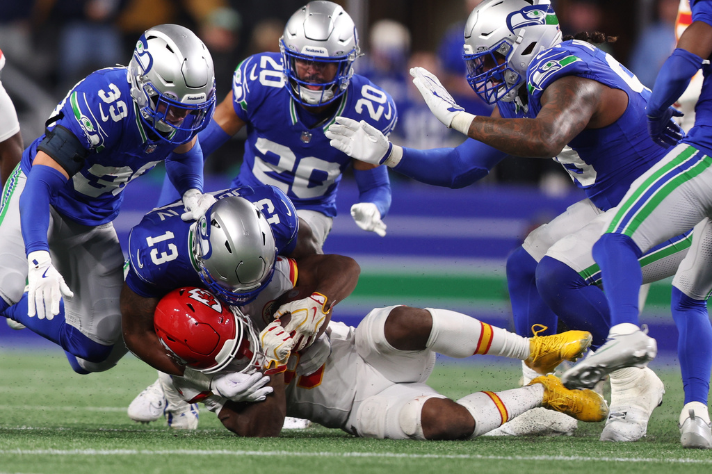 Kansas City Chiefs running back Kenneth Walker II is brought down by Seattle Seahawks linebacker Ernest Jones IV (13) during the second half of an NFL football game in Seattle, Sunday, Oct. 25, 2026. (AP Photo/Kevin Ng)