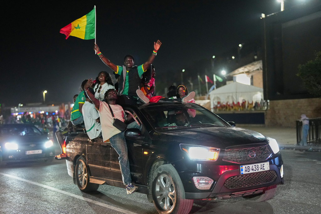 Fans celebrate after Senegal won the Africa Cup of Nations in Dakar, Senegal, Sunday, Jan. 18, 2026. (AP Photo/Misper Apawu)