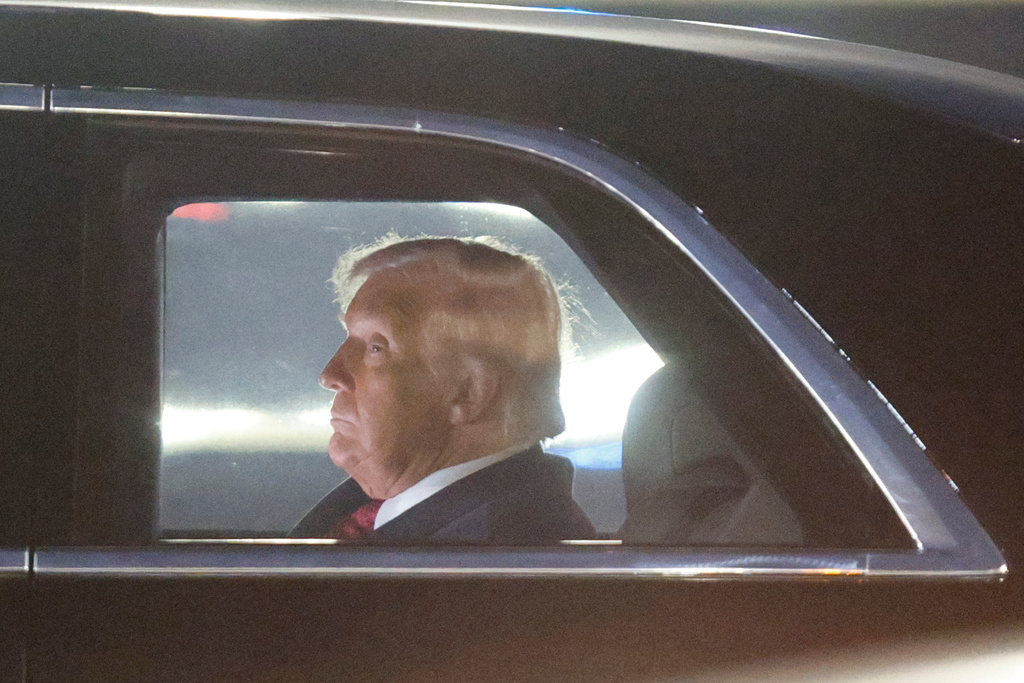 President Donald Trump is seen in his limousine, known as "The Beast," upon his arrival at Joint Base Andrews, Md., Wednesday, Nov. 5, 2025, after giving a speech at the American Business Forum in Miami. (AP Photo/Luis M. Alvarez)