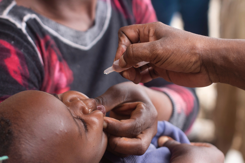 A healthcare worker administers polio vaccine to a child in the Ndirande Township of Blantyre, Malawi, Wednesday, Feb. 11, 2026. (AP Photo/Kenneth Jali)