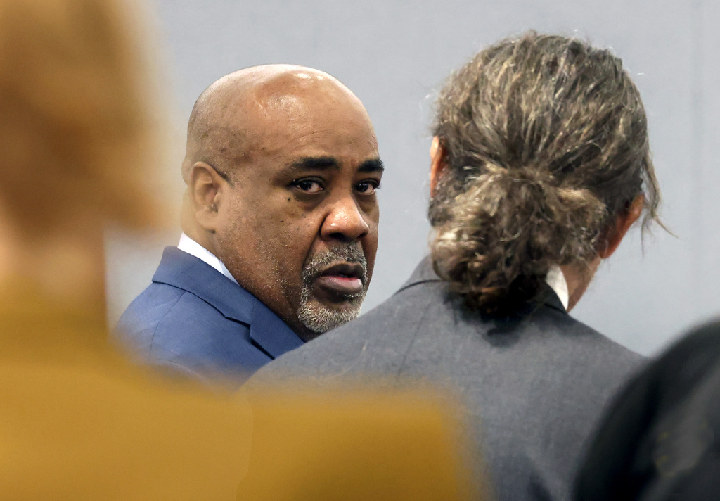 Duane Davis, center, chats with his attorney Michael Sanft during the fourth day of jury selection for his murder trial in Clark County District Court at the Regional Justice Center on Thursday, Aug. 13, 2026, in Las Vegas. Davis was indicted on murder charges for his involvement in the killing of rapper Tupac Shakur in 1996. (Bizuayehu Tesfaye/Las Vegas Review-Journal via AP, Pool)