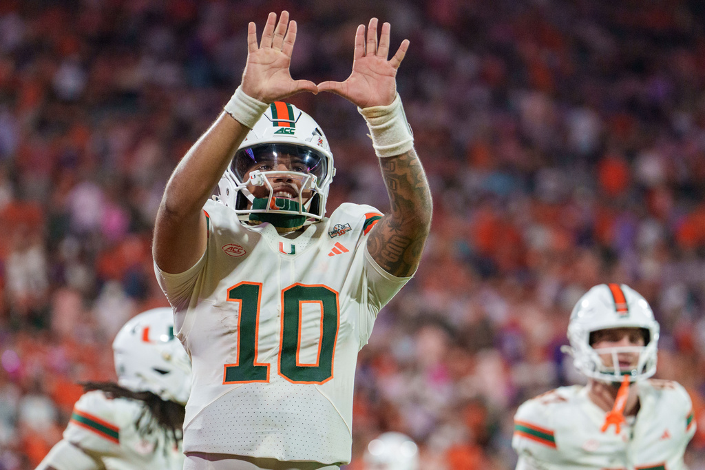 Miami quarterback Darian Mensah (10) celebrates in the second half of an NCAA college football game against Clemson, Saturday, Oct. 3, 2026, in Clemson, S.C. (AP Photo/Jacob Kupferman)