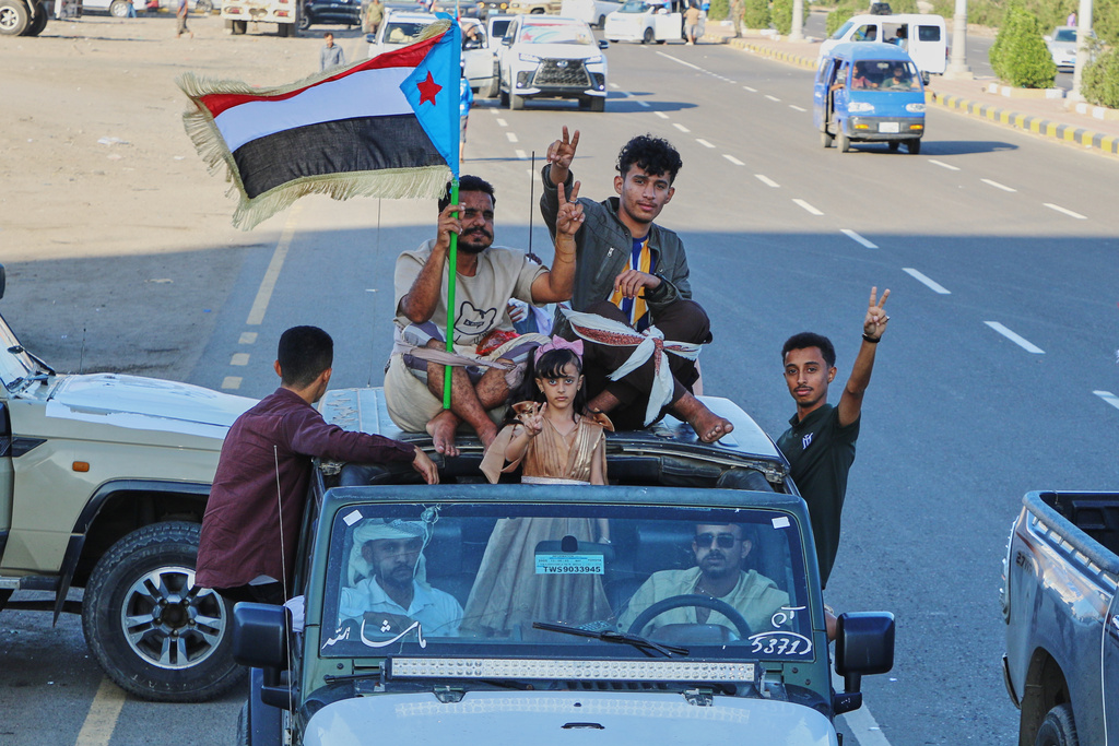 Supporters of the Southern Transitional Council (STC), a coalition of separatist groups seeking to restore the state of South Yemen, hold a South Yemen flag during a rally, in Aden, Yemen, Dec. 25, 2025. (AP Photo)