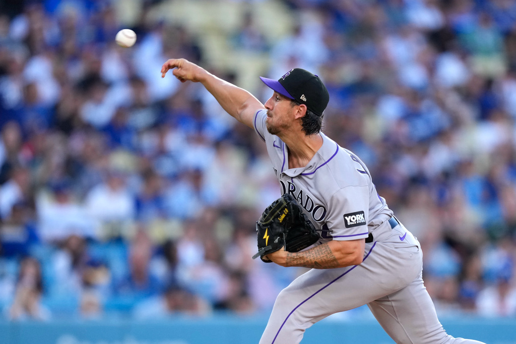 Colorado Rockies starting pitcher Michael Lorenzen throws to the plate during the first inning of a baseball game against the Los Angeles Dodgers, Tuesday, July 7, 2026, in Los Angeles. (AP Photo/Mark J. Terrill)