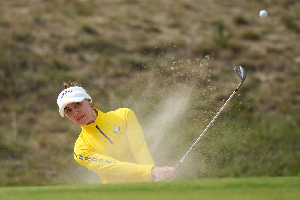Charley Hull of Europe plays from a bunker near the 8th green during the Solheim Cup in Den Bosch, Netherlands, Saturday, Sept. 12, 2026. (AP Photo/Alastair Grant)