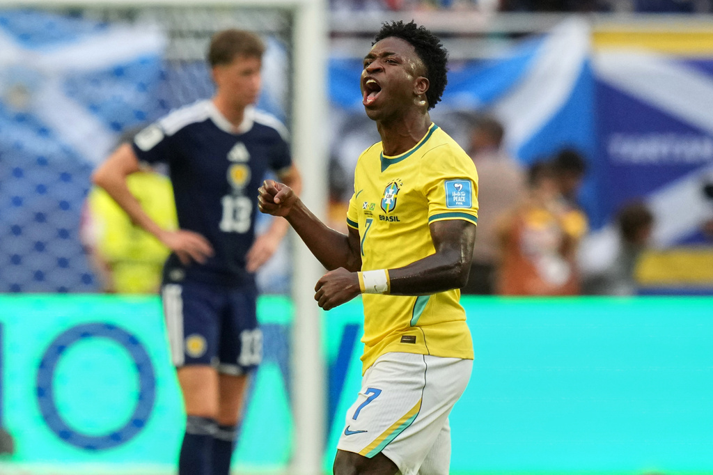 Brazil's Vinicius Junior (7) celebrates after scoring their opening goal during the World Cup Group C soccer match between Scotland and Brazil in Miami Gardens, Fla., Wednesday, June 24, 2026. (AP Photo/Lynne Sladky)