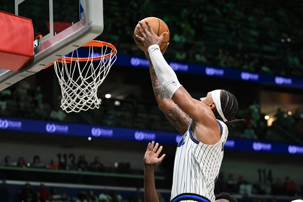 Orlando Magic forward Paolo Banchero (5) dunks in the second half against the New Orleans Pelicans in an NBA basketball game in New Orleans, Sunday, April 5, 2026. (AP Photo/Ella Hall)
