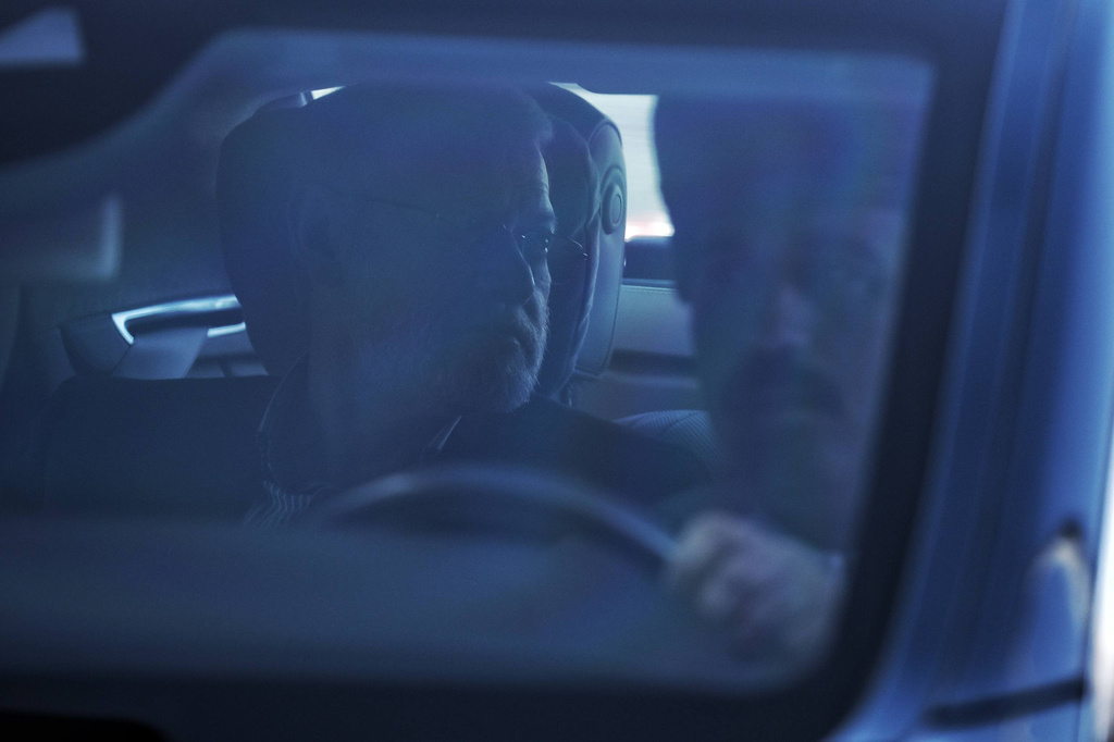 In this photo released by Iran's Supreme National Security Council office, Secretary of the Supreme National Security Council Ali Larijani sits in a car upon his arrival in Muscat, Oman, Tuesday, Feb. 10, 2026. (Erfan Kouchari/Iran's Supreme National Security Council Office via AP)
