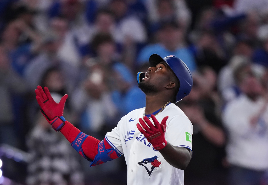 Toronto Blue Jays outfielder Jesús Sánchez reacts at home plate after hitting a two run home run against the Athletics during third inning American League baseball action in Toronto on Sunday, March 29, 2026. (Nathan Denette/The Canadian Press via AP)