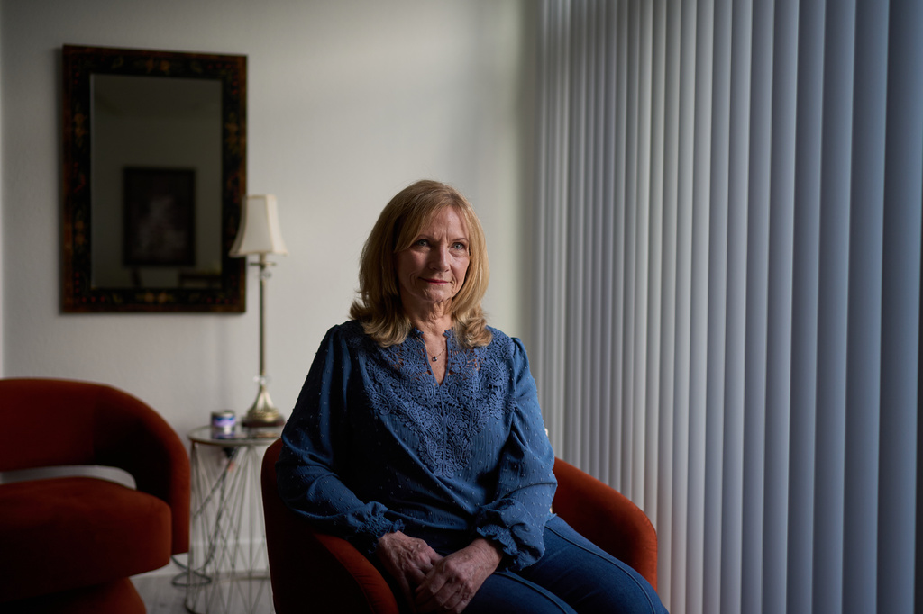 Debra Fox, who had $58,000 stolen from her in a romance scam, is photographed at her home, Tuesday, May 12, 2026, in Arvada, Colo. (AP Photo/David Goldman)