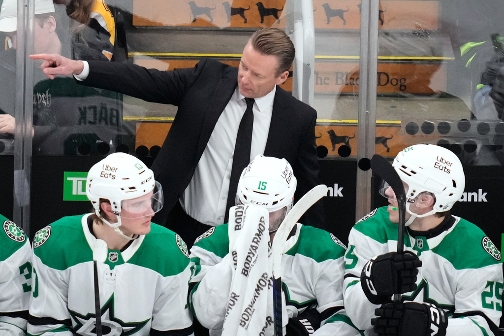 Dallas Stars head coach Glen Gulutzan talks with his players during the second period of an NHL hockey game against the Boston Bruins, Tuesday, March 31, 2026, in Boston. (AP Photo/Charles Krupa)