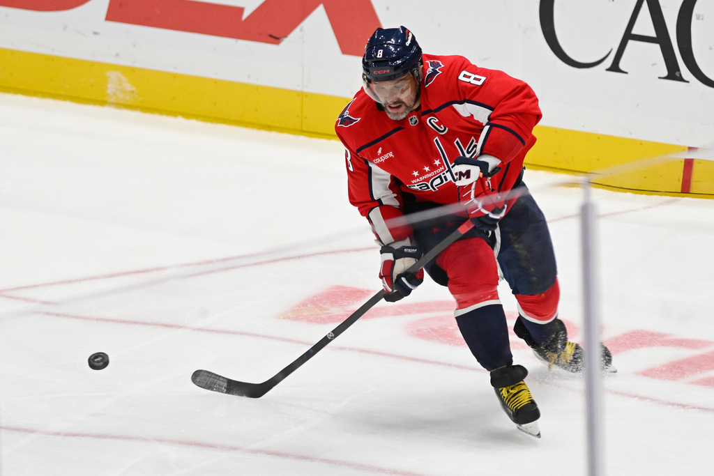 Washington Capitals left wing Alex Ovechkin (8) scores his 900th NHL career goal against the St. Louis Blues during the second period of an NHL hockey game, Wednesday, Nov. 5, 2025, in Washington. (AP Photo/John McDonnell)
