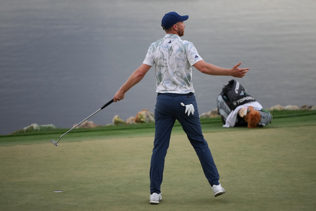 Daniel Berger reacts after making a putt on the 18th hole during the final round of the Arnold Palmer Invitational at Bay Hill golf tournament Sunday, March 8, 2026, in Orlando, Fla. (AP Photo/Matt Slocum)