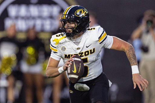 Missouri quarterback Matt Zollers rolls out to pass during the second half of an NCAA college football game against Vanderbilt, Saturday, Oct. 25, 2025, in Nashville, Tenn. (AP Photo/Wade Payne) Missouri quarterback Matt Zollers rolls out to pass during the second half of an NCAA college football game against Vanderbilt, Saturday, Oct. 25, 2025, in Nashville, Tenn. (AP Photo/Wade Payne)