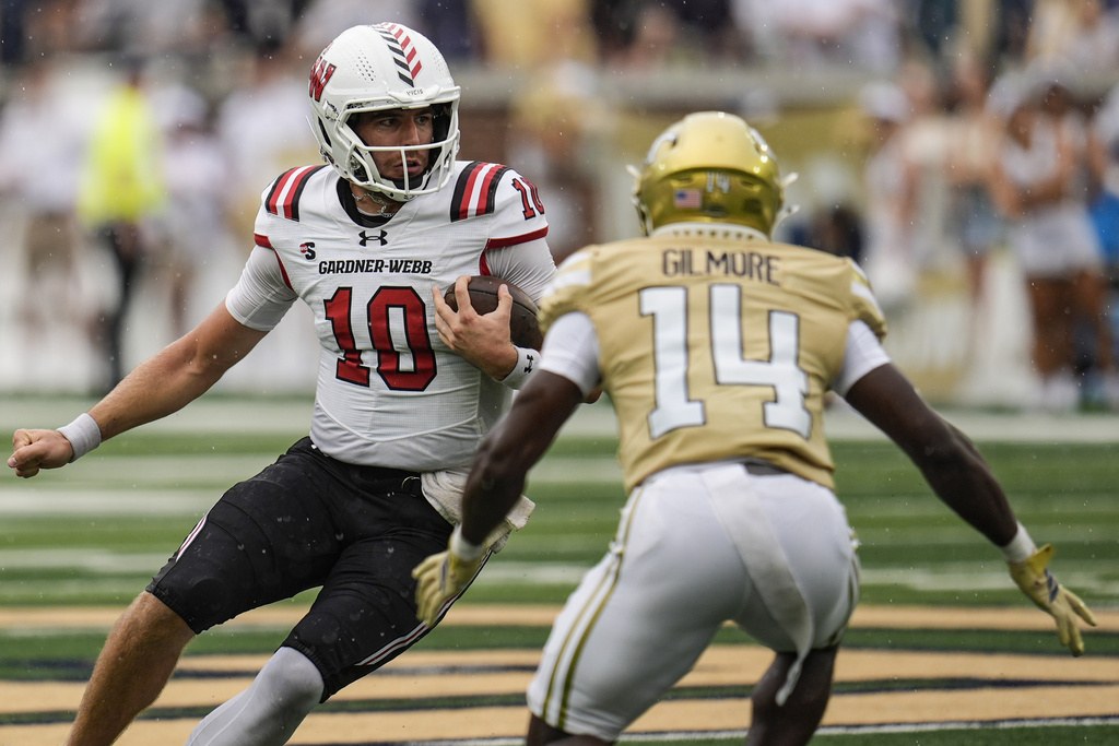 Gardner-Webb quarterback Nate Hampton (10) runs against Georgia Tech defensive back Jy Gilmore (14) during the first half of an NCAA college football game, Saturday, Sept. 6, 2025, in Atlanta. (AP Photo/Mike Stewart)