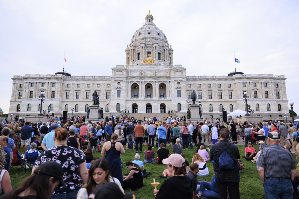FILE - People attend a candlelight vigil for former House Speaker Melissa Hortman and her husband Mark, who were fatally shot, at the state Capitol, June 18, 2025, in St. Paul, Minn. (AP Photo/Nikolas Liepins, File)