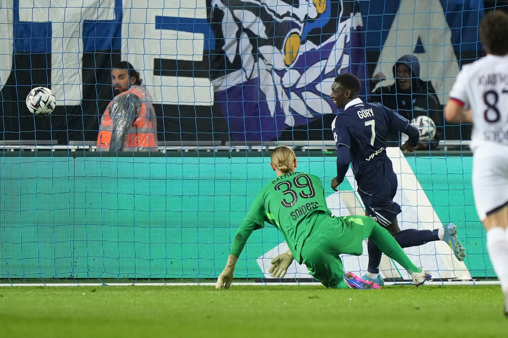 Paris FC's Alimami Gory, second from right, celebrates after scoring his side's second goal past PSG's goalkeeper Matvey Safonov during the French League One soccer match between Paris FC and Paris Saint-Germain in Paris, Sunday, May 17, 2026. (AP Photo/Michel Euler)