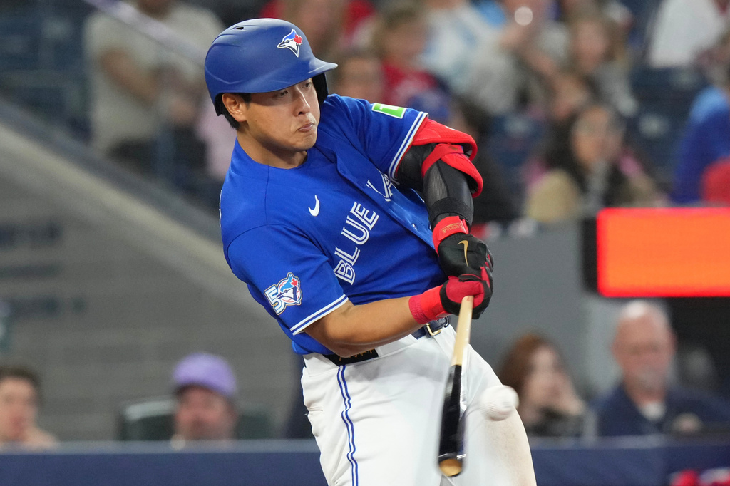Toronto Blue Jays' Kazuma Okamoto (7) singles off Cleveland Guardians pitcher Matt Festa (52) during the sixth inning of a baseball game in Toronto, Saturday, April 25, 2026. (Chris Young/The Canadian Press via AP)
