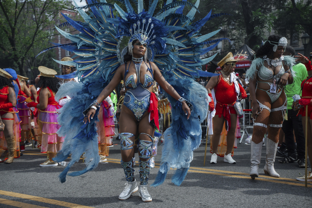 Costumed dancers perform during the West Indian Day Parade on Monday, Sept. 1, 2025, in the Brooklyn borough of New York. (AP Photo/Olga Fedorova)