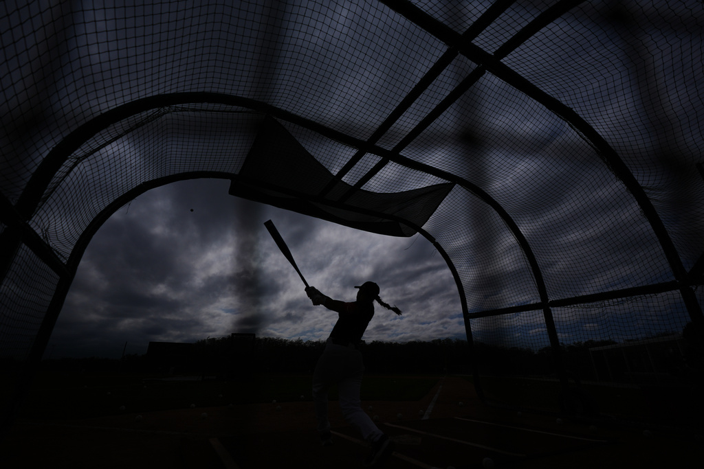 A player hits during a Women's Pro Baseball League (WPBL) practice, Wednesday, March 18, 2026, in Fort Myers, Fla. (AP Photo/Rebecca Blackwell)