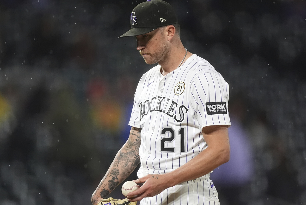 Colorado Rockies starting pitcher Kyle Freeland waits to be pulled from the mound after giving up an RBI double to Miami Marlins' Javier Sanoja in the sixth inning of a baseball game Tuesday, Sept. 16, 2025, in Denver. (AP Photo/David Zalubowski)