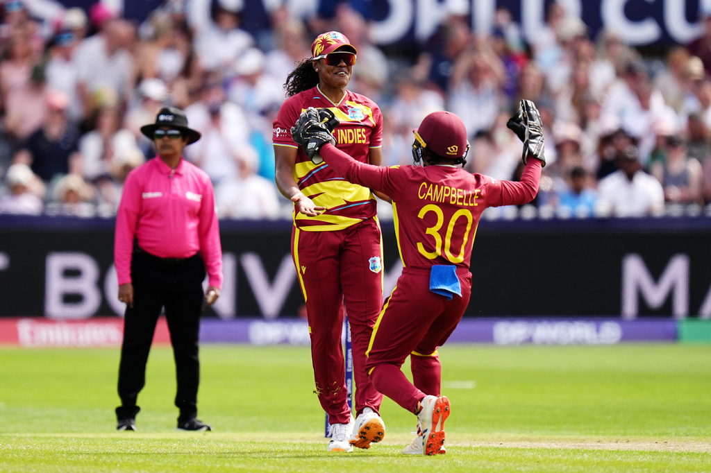 West Indies' Hayley Matthews, left, celebrates taking the wicket of Sri Lanka's Harshitha Samarawickrama during the ICC Women's T20 World Cup match between Sri Lanka and West Indies, in Manchester, England, Sunday, June 21, 2026. ( Jacob King/PA via AP)