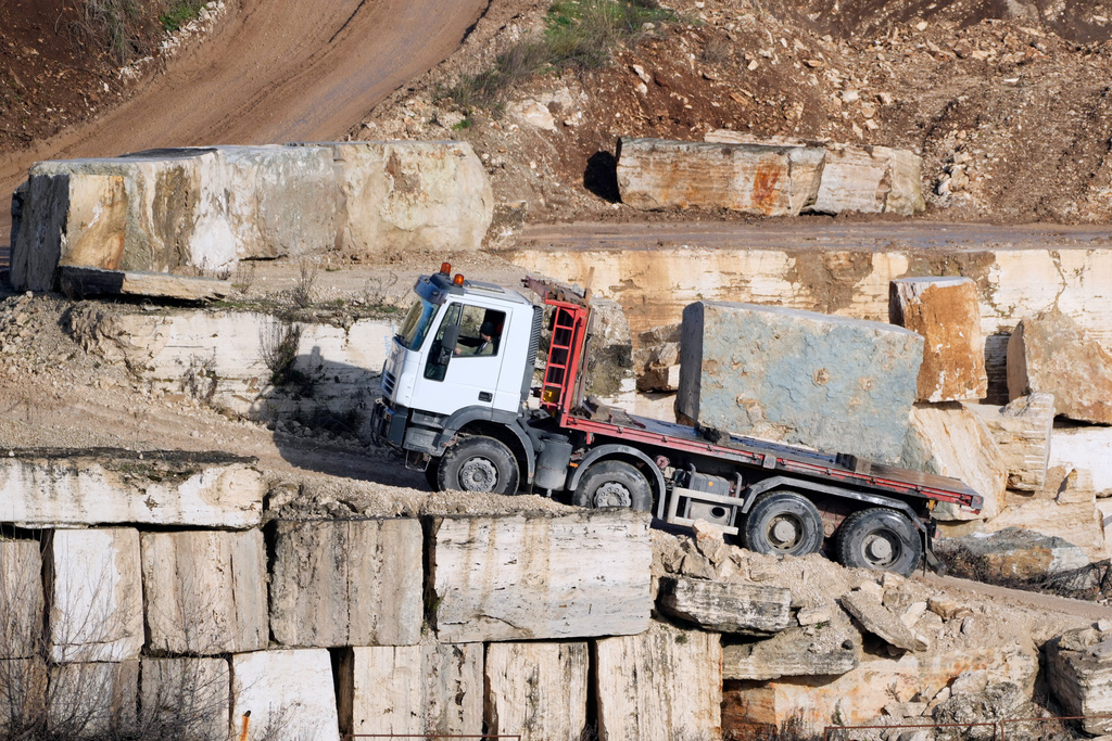 A truck carries a block of travertine at the Degemar Quarry near Tivoli, Italy, 35 kilometers east of Rome, on Friday, Feb. 13, 2026, where 17th-century Baroque architect Gian Lorenzo Bernini selected travertine for the colonnade of St. Peter's Square. (AP Photo/Gregorio Borgia)