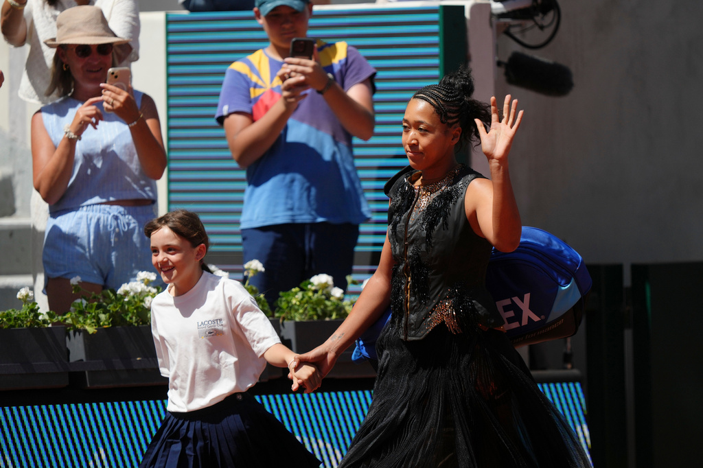 Naomi Osaka of Japan enters the court for the first round women's singles tennis match against Laura Siegemund of Germany at the French Open tennis tournament in Paris, Tuesday, May 26, 2026. (AP Photo/Aurelien Morissard)