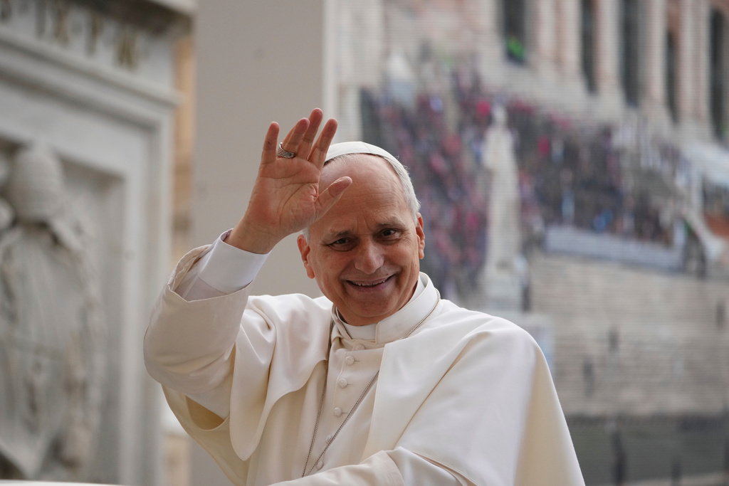 Pope Leo XIV waves as he leaves after his weekly general audience in St. Peter's Square at The Vatican, Wednesday, Dec.17, 2025. (AP Photo/Alessandra Tarantino)