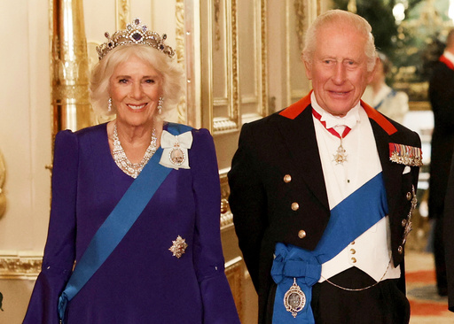 FILE - Britain's Queen Camilla, left, and King Charles III, right, pose for a photo before a State Banquet at Windsor Castle, in Windsor, England, Sept. 17, 2025. (Phil Noble/Pool Photo via AP, file) FILE - Britain's Queen Camilla, left, and King Charles III, right, pose for a photo before a State Banquet at Windsor Castle, in Windsor, England, Sept. 17, 2025. (Phil Noble/Pool Photo via AP, file)