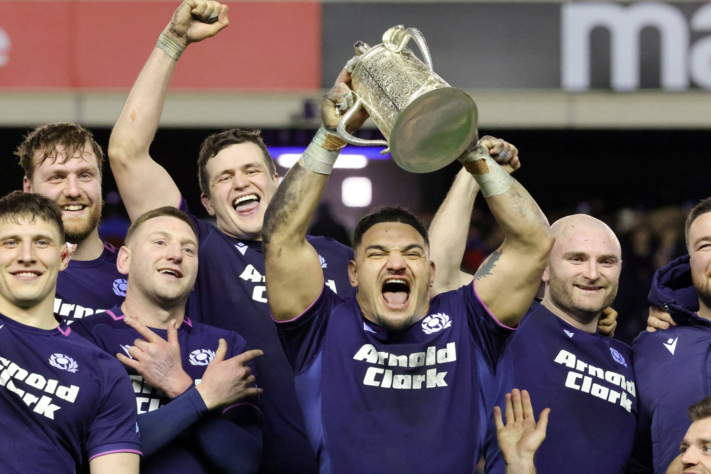 Scotland's Sione Tuipulotu lifts the Calcutta Cup after winning the Six Nations rugby union match between Scotland and England in Edinburgh, Scotland, Saturday Feb. 14, 2026. (Steve Welsh/PA via AP)