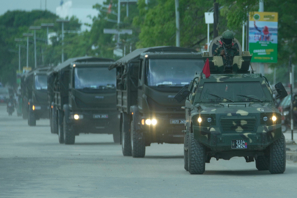 Tanzanian soldiers patrol the street during vote counting in Zanzibar, Tanzania, Friday, Oct. 31, 2025. (AP Photo/Brian Inganga)