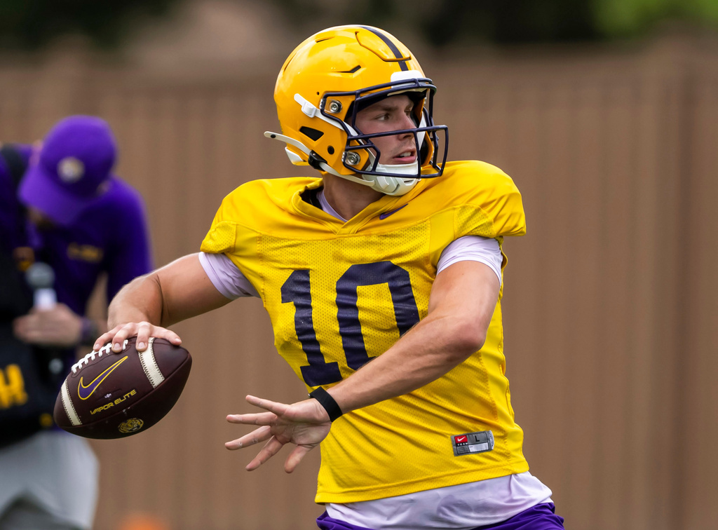 LSU quarterback Sam Leavitt sets up to pass the ball during an NCAA college football practice Monday, Aug. 10, 2026, in Baton Rouge, La. (Michael Johnson/The Advocate via AP)