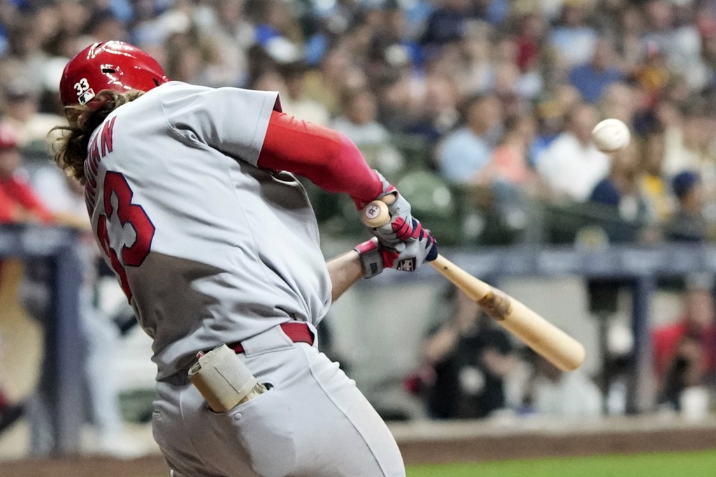 St. Louis Cardinals' Brendon Donovan hits a single during the seventh inning of a baseball game against the Milwaukee Brewers Friday, Sept. 12, 2025, in Milwaukee. (AP Photo/Morry Gash)