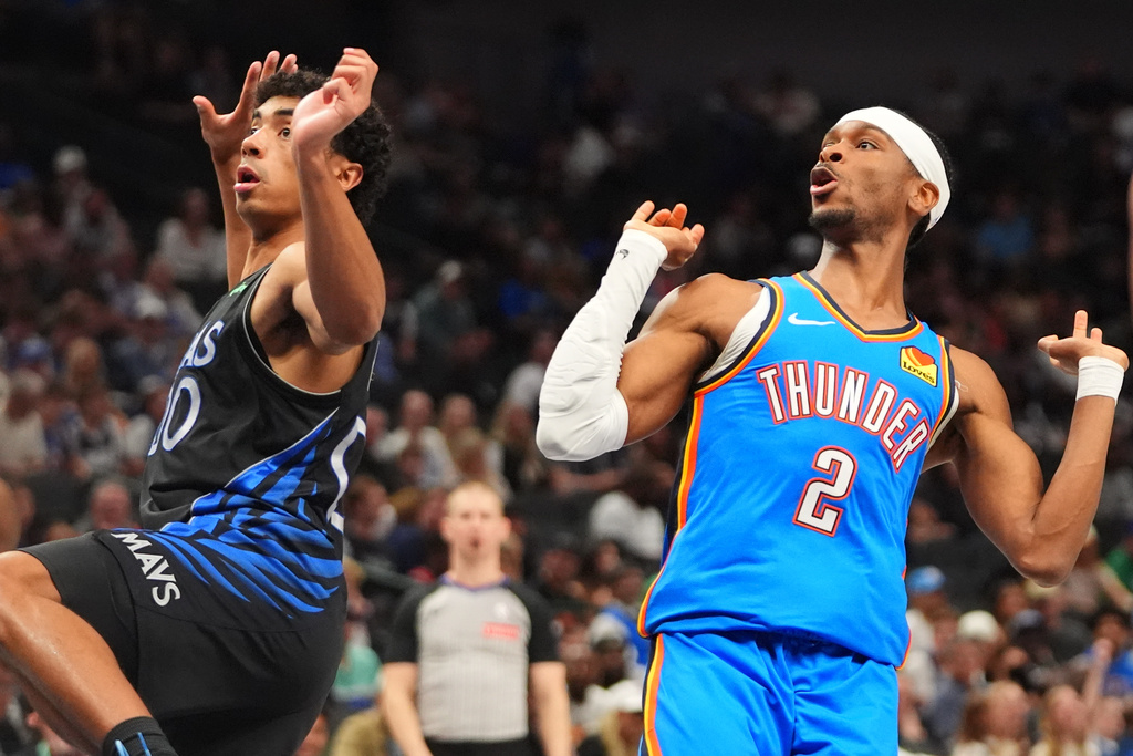 Oklahoma City Thunder guard Shai Gilgeous-Alexander (2) reacts to his shot against Dallas Mavericks guard Max Christie (00) during the second half of an NBA basketball game in Dallas, Sunday, March 1, 2026. (AP Photo/LM Otero)