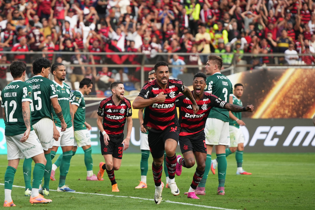Danilo of Brazil's Flamengo, center, celebrates after scoring his side's opening goal against Brazil's Palmeiras during a Copa Libertadores final soccer match in Lima, Peru, Saturday, Nov. 29, 2025. (AP Photo/Guadalupe Pardo)