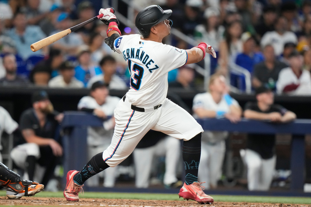 Miami Marlins' Heriberto Hernandez (13) watches after hitting a two run home run during the fourth inning of a baseball game against the San Francisco Giants, Saturday, June 20, 2026, in Miami. (AP Photo/Lynne Sladky)
