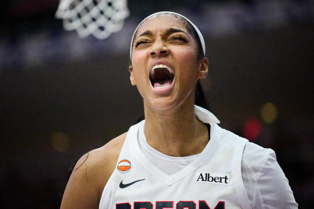 Atlanta Dream's Angel Reese reacts after scoring against the Toronto Tempo during the second half of a WNBA basketball game in Toronto, on Sunday, June 14, 2026. (Sammy Kogan/The Canadian Press via AP)