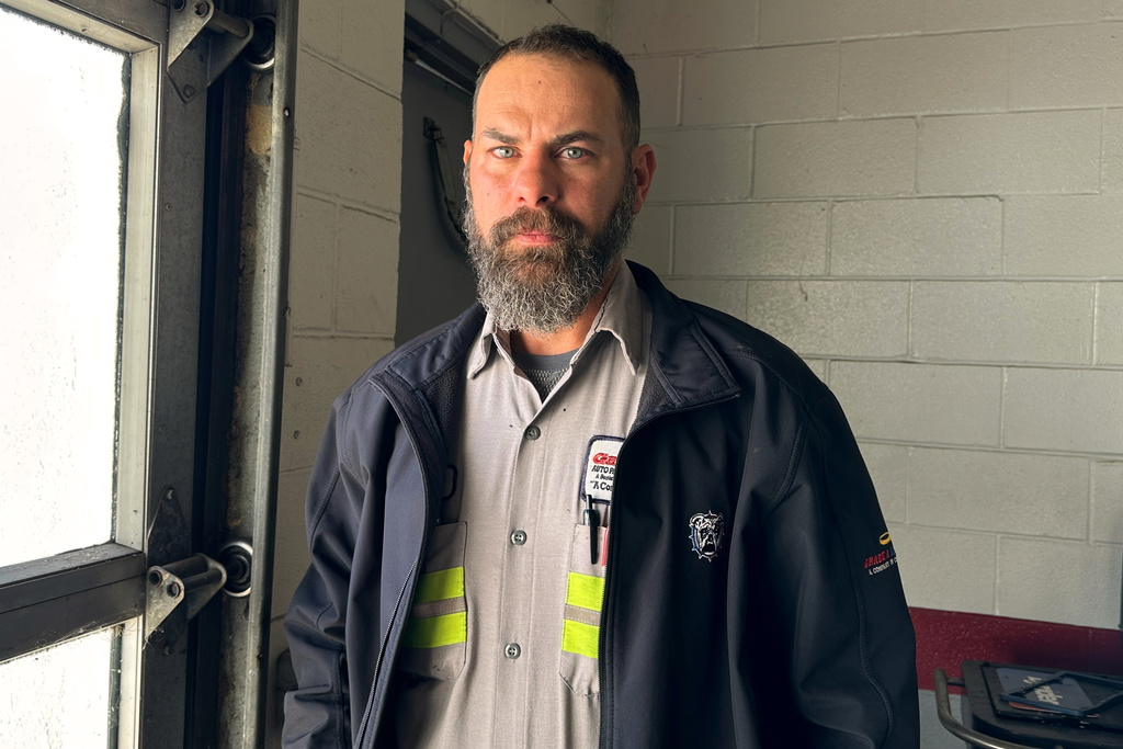 Adam Bowman, a supervisor at Grade A Auto Parts Recycling, stands for a portrait on Thursday, Nov. 13, 2025, in Louisville, Ky. (AP Photo/Dylan Lovan)