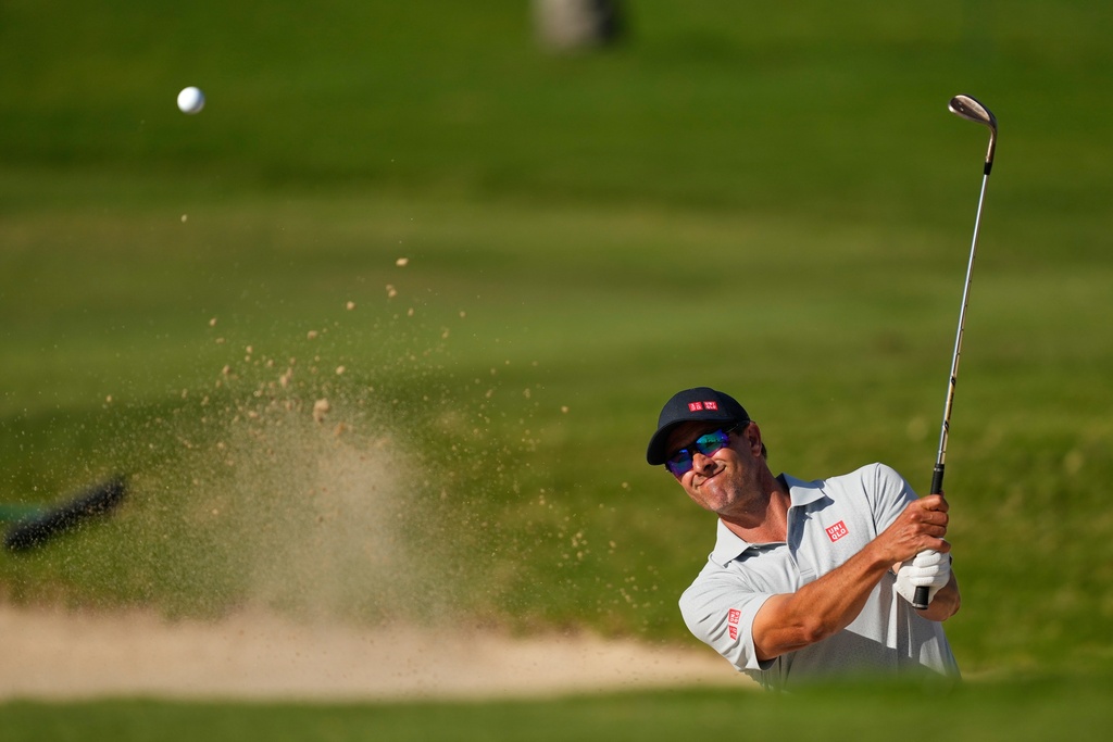Adam Scott, of Australia, hits from a bunker on the 13th hole during the second round of the Sony Open golf event at the Waialae Country Club in Honolulu, Friday, Jan. 16, 2026. (AP Photo/Matt York)