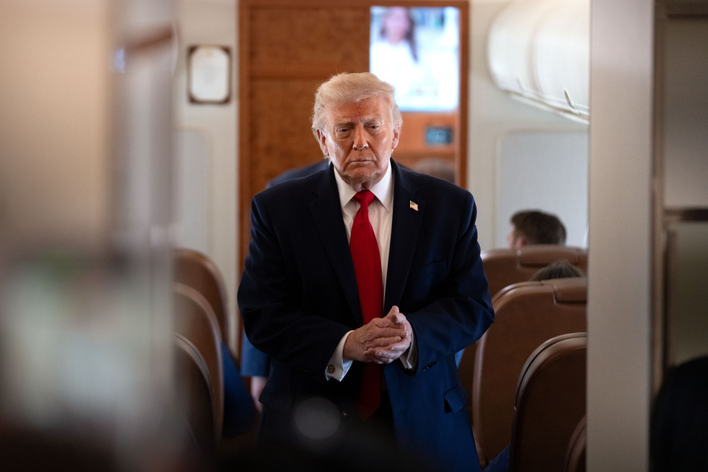 President Donald Trump arrives to speak to reporters aboard Air Force One en route from Joint Base Andrews, Md., to Eau Claire, Wis., Friday, June 5, 2026. (AP Photo/Mark Schiefelbein)