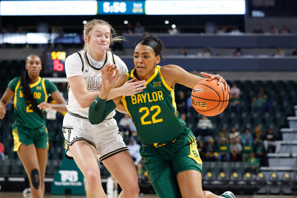 Baylor forward Bella Fontleroy (22) drives to the basket against Lindenwood guard Ellie Brueggemann, front left, in the first half of an NCAA college basketball game, Sunday, Nov. 9, 2025, in Waco, Texas. (Chris Jones/Waco Tribune-Herald via AP)