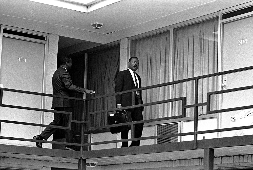 FILE - Rev. Martin Luther King, Jr. is pictured walking across the balcony of the Lorraine Motel in Memphis, Tenn. on April 3, 1968. (AP Photo/Charles Kelly, File)